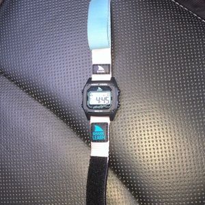 light blue, light pink, and black shark watch.